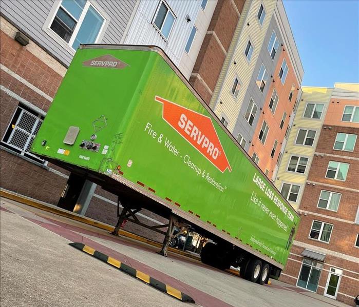 SERVPRO green trailer in front of building